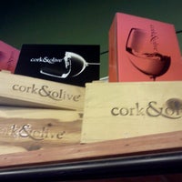 Photo taken at Cork &amp;amp; Olive by Topher A. on 7/13/2012