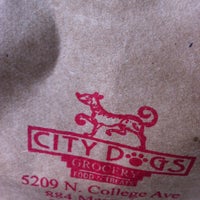 Photo taken at City Dogs Grocery by Neal B. on 4/4/2012