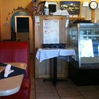 Photo taken at Greek Cafe &amp; Bakery by Megan E. on 9/4/2012