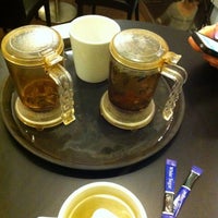 Photo taken at Naked Tea &amp;amp; Coffee Company by lizzy_kzd on 1/5/2012