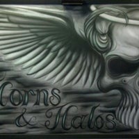 Photo taken at Horns and Halos Tattoo by Camel V. on 10/3/2011