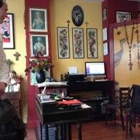Photo taken at The Family Business Tattoo Shop by Marcelo A. on 5/28/2012