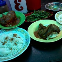 Photo taken at Genteng Biru Food Center by Wee P. on 9/21/2011
