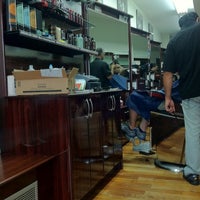 Photo taken at East 6th Street Barber Shop by Logan K. on 8/18/2011