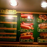 Photo taken at Nathan&amp;#39;s Famous by Nikki G. on 12/31/2011