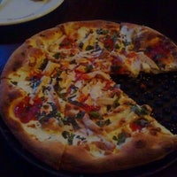 Photo taken at Goodfella&#39;s Woodfired Pizza Pasta Bar by Saulo E. on 11/2/2011