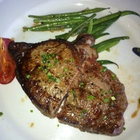 Photo taken at Simms Steakhouse by Elliot P. on 5/20/2012