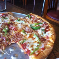 Photo taken at Mogio&amp;#39;s Gourmet Pizza by Jennifer H. on 7/26/2012