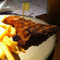 Photo taken at Nando&amp;#39;s by Sue W. on 11/10/2011
