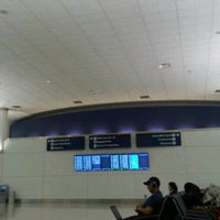 Photo taken at Gate 65 by Wen Y. on 6/13/2012