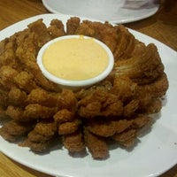 Photo taken at Outback Steakhouse by Ona L. on 12/16/2011