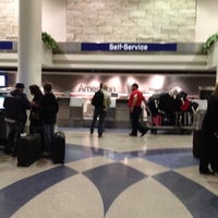 Photo taken at American Airlines Curbside Check-in by Tony on 4/6/2012