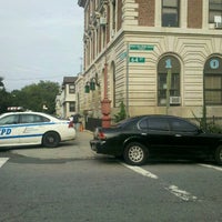 Photo taken at NYPD - 104th Precinct by Lauren C. on 8/21/2012