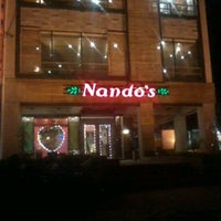 Photo taken at Nando&amp;#39;s by Faaez R. on 12/30/2011