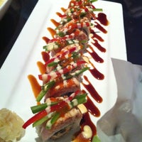 Photo taken at Ocean Blue Sushi Club by 兜兜  on 7/2/2011