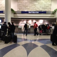 Photo taken at American Airlines Curbside Check-in by Tony on 4/6/2012