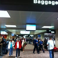 Photo taken at Gate B10 by Tien D. on 3/11/2012