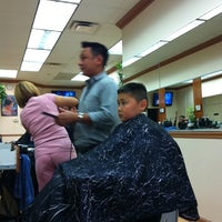 Photo taken at Cut N Edge Family Barbershop by Rob P. on 9/28/2011