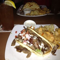 Photo taken at Champps Restaurant by Lisa F. on 8/8/2012