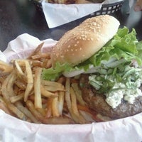 Photo taken at Sinful Burger Sports Grill by Heather P. on 7/9/2011