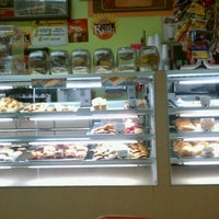 Photo taken at Rainbow Donuts by Jose E D. on 10/16/2011