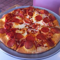 Photo taken at Molokai Pizza Cafe by Aaron L. on 3/10/2011