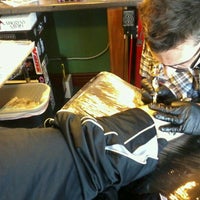 Photo taken at Madison Tattoo Shoppe by Tommy H. on 12/14/2011