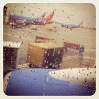 Photo taken at Gate E12 by Brian O. on 11/27/2011