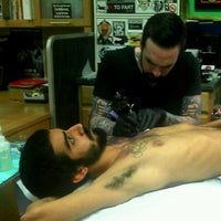 Photo taken at Rock-A-Billy Tattoo &amp;amp; Piercing Studio by Gabriel N. on 12/15/2011