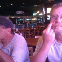 Photo taken at Mugshots Sports Bar and Grill by Brian A. on 3/19/2012