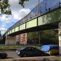 Photo taken at East 8th Street Footbridge by Justin W. on 6/5/2012