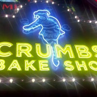 Photo taken at Crumbs Bake Shop by Jenn C. on 12/4/2011