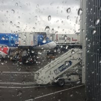 Photo taken at Gate 80 by Cian H. on 3/17/2012