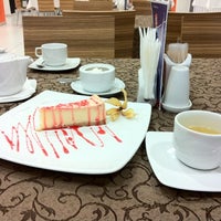 Photo taken at IT Cafe by Olga on 3/20/2012