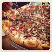 Photo taken at Grande Pizzeria by Serena T. on 3/27/2012