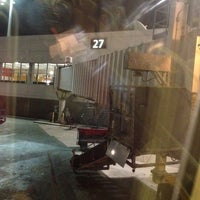 Photo taken at Gate 27 by Shelly O. on 12/22/2011
