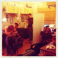 Photo taken at Follow the Rabbit Tattoo Studio by ᴡ M. on 5/30/2012