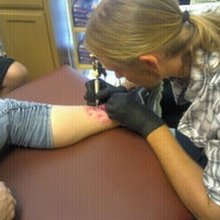 Photo taken at House Of Pain Tattoo by Courtney V. on 10/1/2011