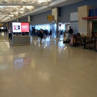 Photo taken at Gate 34 by Marco T. on 3/25/2012