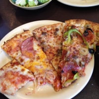 Photo taken at Jim&amp;#39;s Pizza by Brandon B. on 7/28/2012