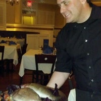 Photo taken at Athos Restaurant by Katie B. on 4/23/2012