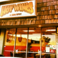 Photo taken at West Coast Hot Wings &amp; BBQ by Rebecca G. on 6/25/2012