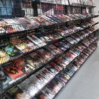 Photo taken at Earth 2 Comics by Lou T. on 9/6/2012
