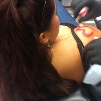 Photo taken at Axis Tattoo and Body Piercing by Nicole A. on 9/13/2012