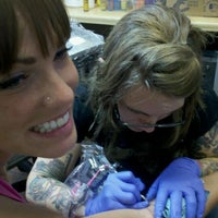 Photo taken at Slave to the Needle Tattoo by Jenna G. on 8/28/2011