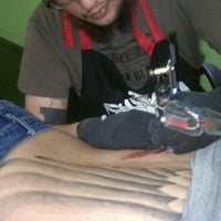 Photo taken at Sacred Blvd Tattoo Parlor by Elmo O. on 1/6/2012