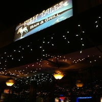 Photo taken at Fishtales On 33rd Bar &amp;amp; Grill by Carlos M. on 3/30/2012