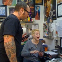 Photo taken at Big Daddy&amp;#39;s Tattoo by Leslie C. on 2/23/2011
