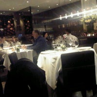 Photo taken at Lumiere Restaurant by Grace W. on 3/5/2011