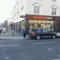 Photo taken at Sainsbury&#39;s Local by Gordon D. on 5/8/2012